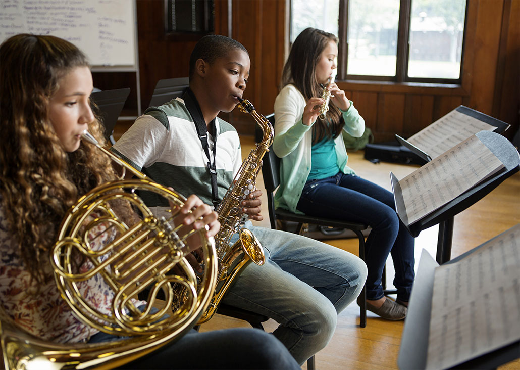 Three pupils (16-17) playing wind instruments