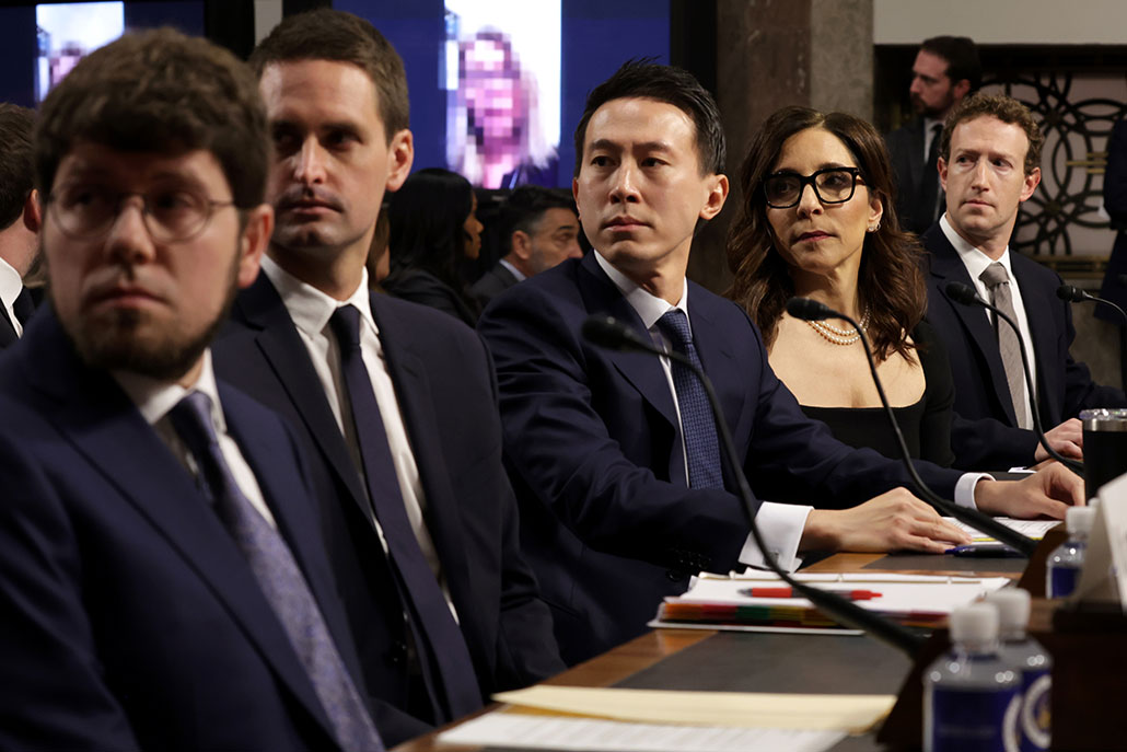 a photo of 5 heads of social media companies sitting at a table during a hearing